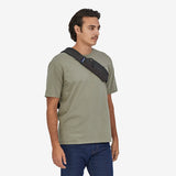Black Patagonia Atom Sling Bag 8L with adjustable strap and zippered compartments for convenient everyday carry