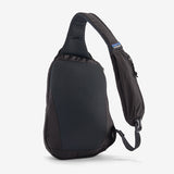 Patagonia Atom Sling Bag 8L in black, showing the front view with adjustable strap and compact design for versatile carrying.