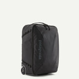Patagonia Black Hole® MLC® Wheelie luggage with black exterior, telescoping handle, and wheels for easy travel.