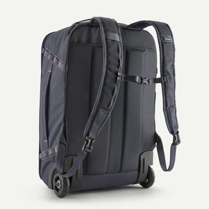 Patagonia Black Hole® MLC® Wheelie luggage in black with wheels and handle, durable travel bag for packing and portability.