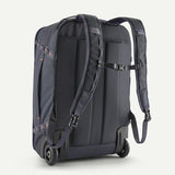 Patagonia Black Hole® MLC® Wheelie luggage in black with wheels and handle, durable travel bag for packing and portability.