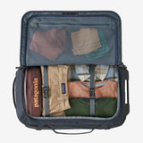 Patagonia Black Hole® Wheeled Duffel Bag 40L in black, featuring durable fabric, wheels, and a spacious main compartment.