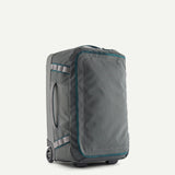 Patagonia Black Hole Wheeled Duffel Bag 40L in black, durable nylon with wheels and handles for travel and storage.