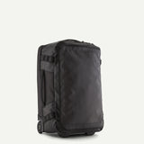 Patagonia Black Hole® Wheeled Duffel Bag 40L in black, showing sturdy wheels and spacious main compartment for travel storage.