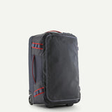 Patagonia Black Hole® Wheeled Duffel Bag 40L in black, showing durable fabric and extendable handle for travel storage