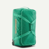 Patagonia Black Hole® Wheeled Duffel Bag 70L in black, featuring wheels, handles, and durable fabric for travel and storage.