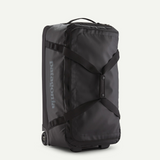 Black Patagonia Black Hole® Wheeled Duffel Bag 70L with sturdy wheels and durable black fabric, ideal for travel and storage.