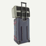 Patagonia Black Hole® wheeled duffel bag in black, 70L capacity, with sturdy wheels and adjustable shoulder straps.