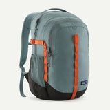 Patagonia Refugio Daypack 26L in black with multiple compartments, padded shoulder straps, and hydration sleeve for outdoor use.