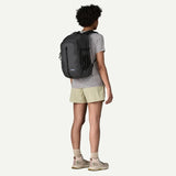 Patagonia Refugio Daypack 26L with multiple compartments, padded shoulder straps, and durable black fabric for outdoor use
