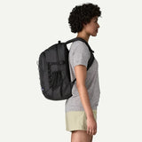 Patagonia Refugio Daypack 26L backpack with multiple compartments, black color, and padded shoulder straps for comfortable carry.