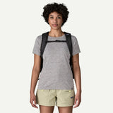 Patagonia Refugio Daypack 26L with adjustable shoulder straps, front pocket, and side mesh compartments on a neutral background.
