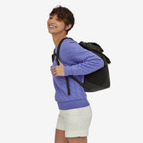 Patagonia Ultralight Black Hole® Tote Pack 27L shown in black, featuring durable fabric and compact design for outdoor and daily use.