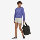 Patagonia Ultralight Black Hole Tote Pack 27L in black, showing lightweight, durable fabric with top handles and spacious interior.