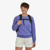 Patagonia Ultralight Black Hole Tote Pack 27L in black, showing durable nylon material and compact design for versatile carrying.