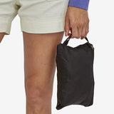 Patagonia Ultralight Black Hole Tote Pack 27L in black, showing lightweight, durable nylon fabric with tote handles and compact design.