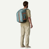 Patagonia Refugio Daypack 32L in black with multiple compartments and padded shoulder straps, suitable for hiking and daily use.