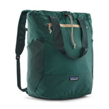 Patagonia Terravia Tote Pack 24L shown with open main compartment and adjustable shoulder straps, eco-friendly reusable bag.