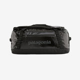 Patagonia Black Hole 55L duffel bag in black, showing durable fabric, zipper closure, and adjustable shoulder strap.
