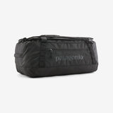 Patagonia Black Hole 55L duffel bag in black with sturdy handles and a spacious main compartment, designed for travel and outdoor use.