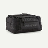 Patagonia Black Hole 55L duffel bag shown in black with sturdy handles and zipper closure, designed for travel and outdoor use.