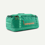 Patagonia Black Hole Duffel Bag 55L in aqua, durable waterproof duffel with carry straps and spacious interior for travel gear.