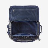 Open Patagonia Black Hole 40L Duffel Bag showing spacious interior and durable black fabric with adjustable shoulder strap.