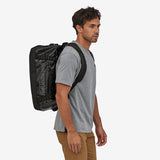 Black Patagonia Black Hole Duffel Bag 40L with sturdy handles and zip closure, shown in black fabric.