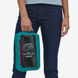 Patagonia Black Hole 40L duffel bag in black, showing its durable material and spacious design for travel and storage.