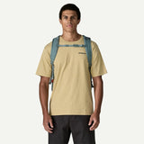 Patagonia Refugio Daypack 30L in black with adjustable shoulder straps, front zipper pocket, and padded laptop compartment.