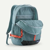 Patagonia Refugio Daypack 30L in black with multiple compartments, padded shoulder straps, and a front logo patch.
