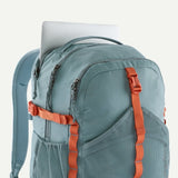 Patagonia Refugio Daypack 30L in black, showing the spacious main compartment, padded shoulder straps, and front zipper pocket.