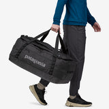 Black Patagonia Black Hole® 70L duffel bag with sturdy handles and zipper closure, made of durable, weather-resistant material.