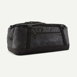 Black Patagonia Black Hole® 70L duffel bag with black handles, durable water-resistant fabric, and zippered compartments.