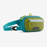 Patagonia Ultralight Black Hole Mini Hip Pack 1L in patchwork subtidal blue, compact and lightweight for outdoor activities.