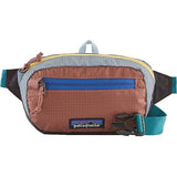 Patagonia Ultralight Black Hole Mini Hip Pack 1L in patchwork Subtidal Blue, compact and lightweight for outdoor adventures.