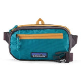 Patagonia Ultralight Black Hole® Mini Hip Pack in patchwork Subtidal Blue, compact 1-liter design with Patagonia logo patch.
