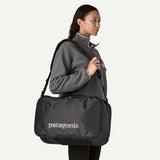 Patagonia Black Hole® Mini MLC® 30L travel backpack with black durable nylon fabric, multiple compartments, and carry handles.