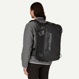 Patagonia Black Hole® Mini MLC® 30L travel backpack showing black exterior, zipper compartments, and durable fabric.
