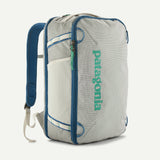 Patagonia Black Hole® Mini MLC® 30L travel backpack with black and blue fabric, compact design, and multiple compartments.