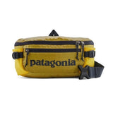 Patagonia Black Hole® Waist Pack 5L in shiny black, shown with adjustable strap and compact storage design.