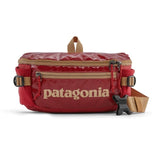Patagonia Black Hole® Waist Pack 5L in shiny black, compact and durable with adjustable strap and multiple storage compartments.