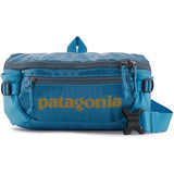 Patagonia Black Hole® Waist Pack 5L in shiny black, showing adjustable strap and compact design for outdoor activities.