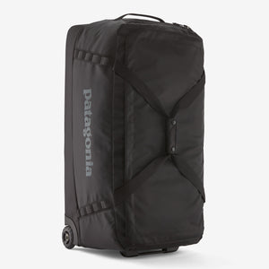 Patagonia Black Hole® Matte Wheeled Duffel 100L with sturdy wheels and black durable fabric for versatile travel storage