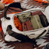 Peak Design 45L outdoor backpack in cloud gray, featuring multiple compartments and padded straps for outdoor adventures.