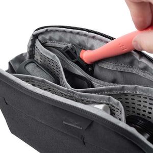 Black Peak Design small wash pouch with zipper closure and compact design, ideal for travel and organization.