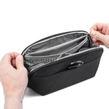 Black Peak Design small wash pouch with zipper closure and compact design for travel organization.