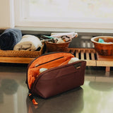Black Peak Design small wash pouch with zipper closure, compact travel toiletry bag for organizing personal items.