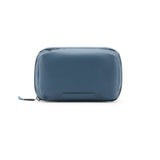 Peak Design Tech Pouch in ocean color, showing a sleek, compact storage bag with multiple compartments for tech accessories.