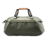 Black Peak Design Travel Duffel 65L with multiple handles and zipper closure, designed for durable, spacious travel storage.